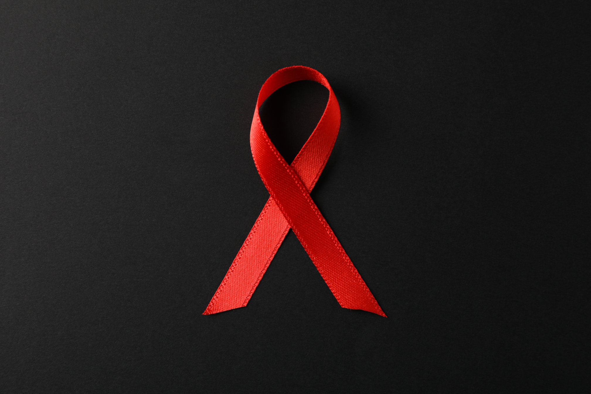 AIDS Awareness Ribbon on Black Background